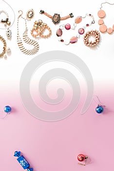 Christmas composition flat lay the balls jewelry necklace bracelet vintage pearls on a pink gradient background white to blue Top