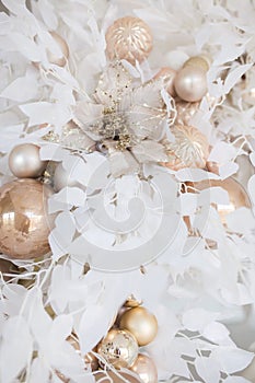 Christmas composition. Garland made of baige balls and white flowerss on white background. Christmas, winter, new year