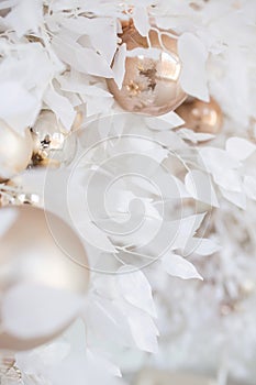 Christmas composition. Garland made of baige balls and white flowerss on white background. Christmas, winter, new year