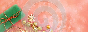 Christmas composition. Gift box, golden toys on red background with blurred bokeh. new year concept. Greeting card, xmas