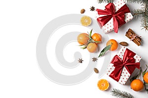 Christmas composition with gift boxes, ripe tangerines and space for text on white background