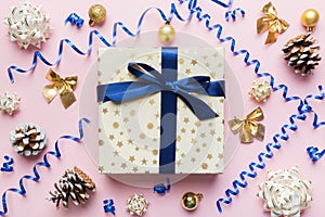 Christmas composition. Gifts box with new year decorations on colored background. Christmas, winter, new year concept