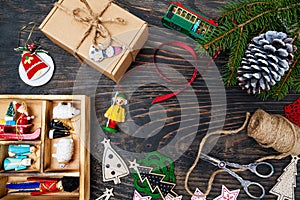 Christmas composition. Gifts, fir branches, decorations on a dark wooden background. Christmas, winter, new year concept. Flat lay