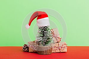 Christmas composition. Gifts, small tree, branches and craft DIY decorations on white background. New year concept