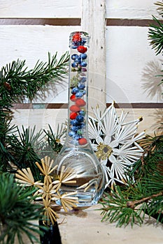 Christmas composition with a glass bottle