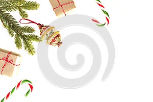 Christmas composition. Green fir, candy canes, Xmas gifts and decoration on white background. Top view, flat lay. Copy