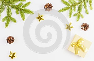 Christmas composition with green fir tree branch, Xmas gifts and decoration on white background. Top view, flat lay