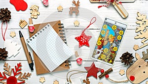 Christmas composition made of decoration and Tarot cards on White background.