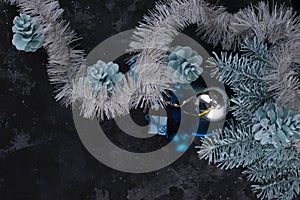 christmas composition minimalistic white-blue toys on a dark background
