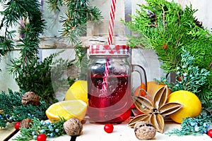 Christmas composition with a mug, coniferous branches and oranges