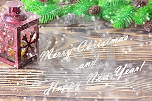 Christmas composition. Christmas and New Year decoration with fir tree branches, lantern on wooden background