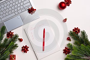 Christmas composition. Notepad with goals for 2021. Notepad  pen  gift boxes  letter envelopes  balls and stars. Concept business