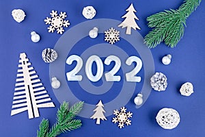 Christmas composition with number 2022, on festive background