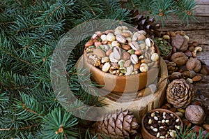 Christmas composition from nuts, tree branches, cones. mix of nuts.