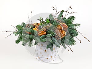 Christmas composition of pine branches, wine corks, orange slices and pine cones