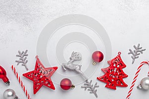 Christmas composition with red and silver gifts on stone background. Xmas holiday 2021 celebration. Flat lay, top view, copy space