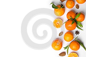 Christmas composition with ripe tangerines and space for text on white background