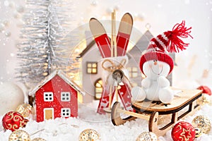 Christmas composition with the snowman on sleigh and festive decorations ÃÂ¾n the snow. Christmas or New Year greeting card