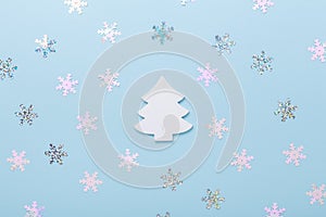 Christmas composition White fir tree and snowflakes on pastel blue background. Christmas, winter, new year concept