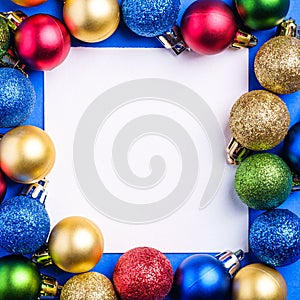 Christmas composition with white square copy space. Colorful ornament and baubles decorations