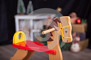 Christmas composition with wooden rocking horse