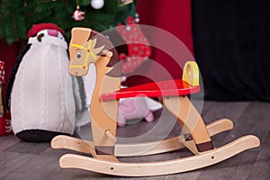 Christmas composition with wooden rocking horse