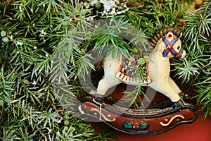 Christmas composition with wooden toy rocking horse