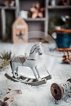 Christmas composition with wooden toy rocking horse