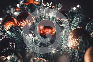 Christmas concept and background with pine tree branches, lights and balls. Happy new year. Selective focus