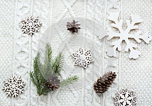 Christmas concept. Christmas bouquet with spruce, fir-tree, snowflakes on white knitted background. Holiday card. Vintage style. F