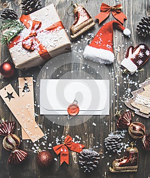 Christmas concept, Christmas decorations. gifts snow on a gray background, with an envelope in the middle