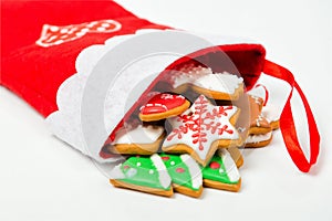 Christmas concept. Christmas sock with gingerbread on white back