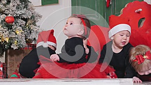 Christmas concept - Little babies crawling on the carpet
