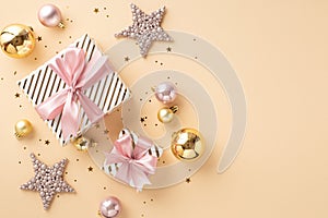 Christmas concept. Top view photo of stylish gift boxes with pink ribbon bows sparkle star ornaments gold and pink baubles and