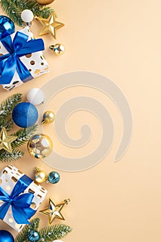 Christmas concept. Top view vertical photo of fir branches in frost star ornaments white blue gold baubles and present boxes with