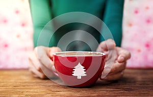 Christmas Concept. Woman Relaxing a Holidays Season by Hot Coffee Latte Indoors photo