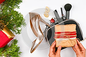 Christmas concept for women`s gifts. Flat lay of female accessories on a white background. Sales, shopping, gift ideas concepts