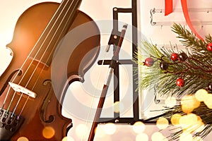 Christmas concert concept with violin and music stand and decoration