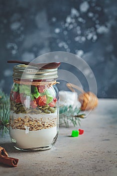 Christmas cookie mix jar. Dry ingredients for cooking Christmas cookies in a jar, dark background.