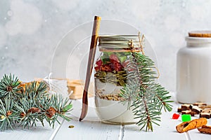 Christmas cookie mix jar. Dry ingredients for cooking Christmas cookies in a jar, white background. Christmas food concept