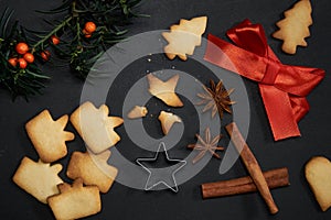 Christmas cookies and decor and cutter on black