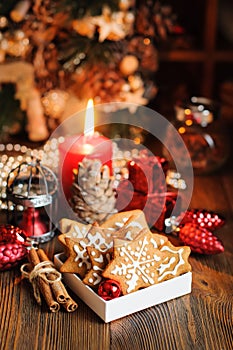 Christmas cookies with decorations on wooden table