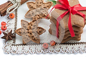 Christmas cookies handmade in the shape of stars with red ribbon