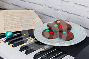 Christmas cookies and music sheet on piano