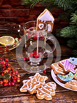 Christmas cookies plate and glass latte mug with berry.