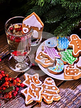 Christmas cookies plate and glass latte mug with berry.