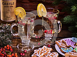 Christmas cookies plate and two glasses mug with bottle.