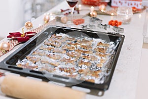 Christmas cookies preparation, closeup of gingerbread baking tray.