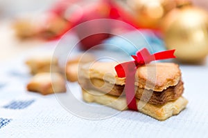 Christmas cookies with red ribbon.