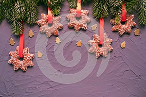 Christmas cookies with red ribbon and little trees in golden color